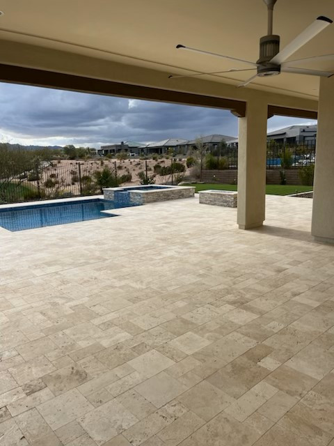 Pool landscaping - large transitional backyard stone and custom-shaped pool landscaping idea in Phoenix