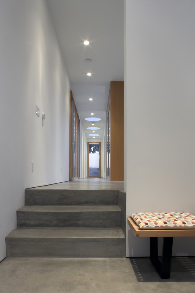 Inspiration for a contemporary entryway in Los Angeles with concrete floors.