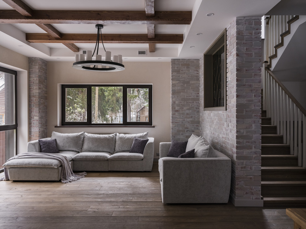Large contemporary formal open concept living room in Moscow with beige walls, medium hardwood floors and grey floor.