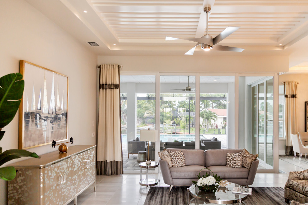 Photo of a large transitional formal open concept living room in Miami with grey walls, ceramic floors and beige floor.