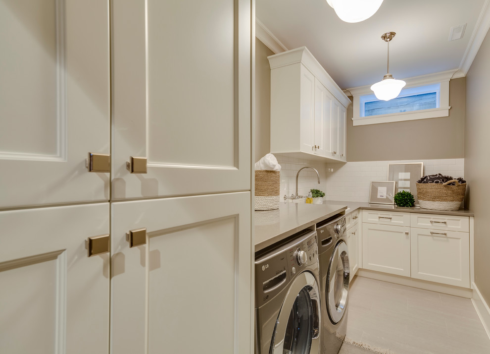 This is an example of a mid-sized traditional l-shaped dedicated laundry room in Vancouver with an undermount sink, recessed-panel cabinets, white cabinets, granite benchtops, brown walls, a side-by-side washer and dryer, beige floor and beige benchtop.
