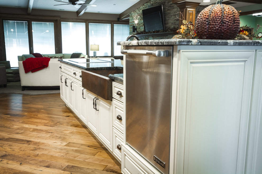 Inspiration for a large transitional l-shaped eat-in kitchen remodel with two islands