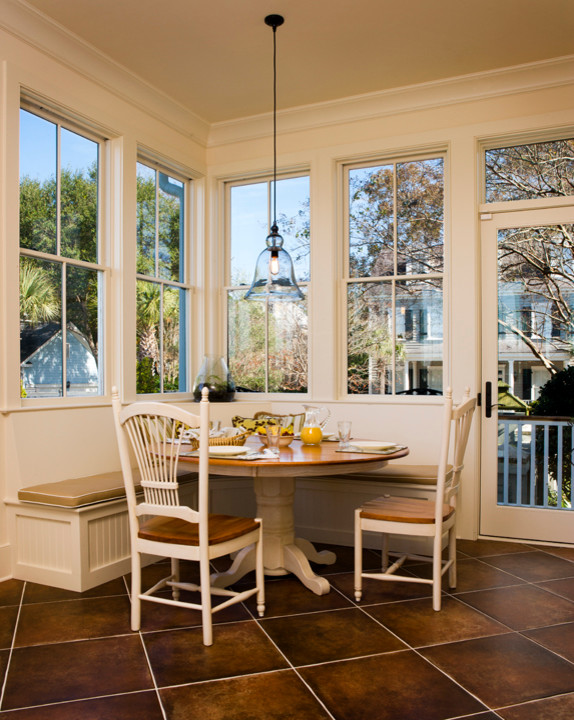 Design ideas for a traditional sunroom in Charleston with terra-cotta floors.