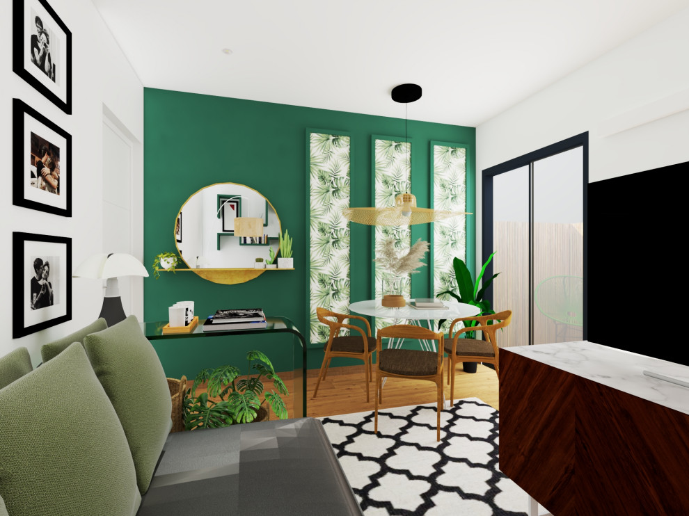 Immagine di una sala da pranzo minimalista di medie dimensioni con pareti verdi e parquet chiaro