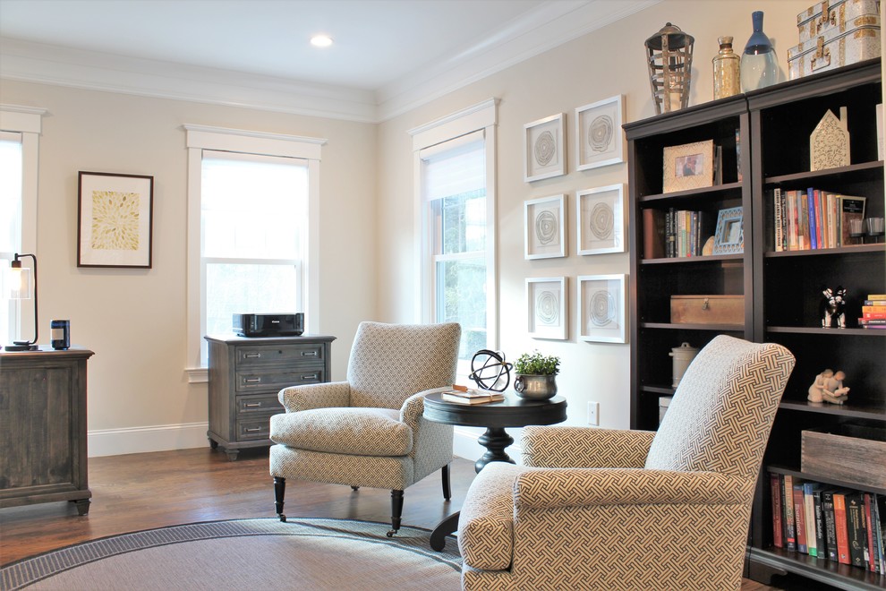 Inspiration for a large transitional freestanding desk dark wood floor and brown floor study room remodel in Boston with beige walls