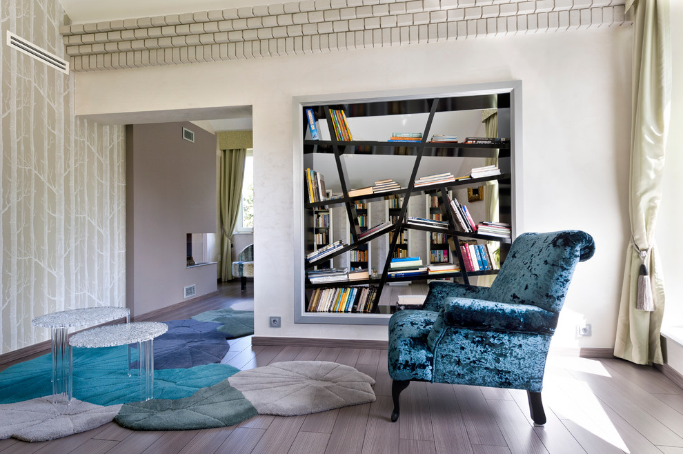 Inspiration for a contemporary family room in Other with a library.