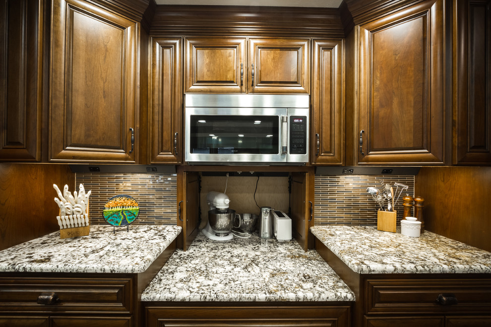 Example of a large transitional l-shaped open concept kitchen design with two islands