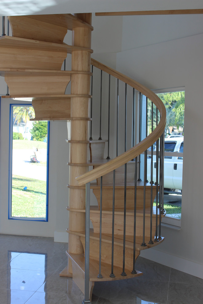 Small transitional wooden spiral mixed material railing staircase photo with wooden risers