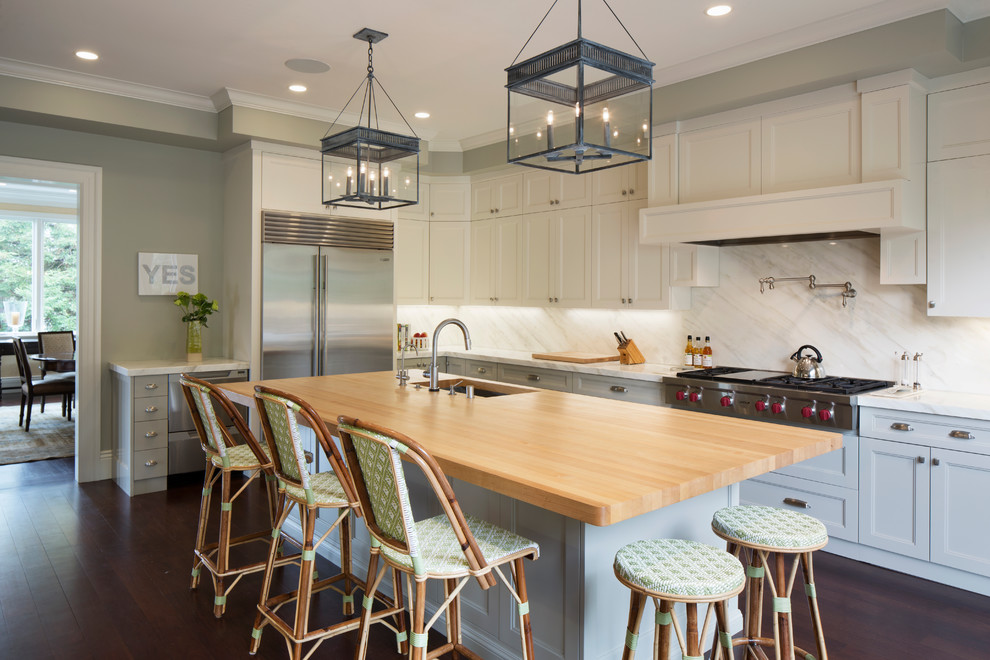Inspiration for a large beach style separate kitchen in San Francisco with an undermount sink, recessed-panel cabinets, white cabinets, dark hardwood floors, with island, marble benchtops, marble splashback and stainless steel appliances.
