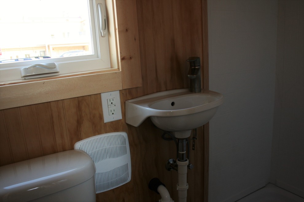 Small mountain style 3/4 dark wood floor alcove shower photo in Seattle with a wall-mount sink, a two-piece toilet and brown walls
