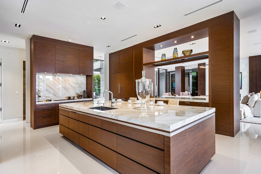 Inspiration for a large contemporary u-shaped kitchen in Miami with flat-panel cabinets, medium wood cabinets, onyx benchtops, marble floors, with island, white floor, beige benchtop, an undermount sink, white splashback and stone slab splashback.