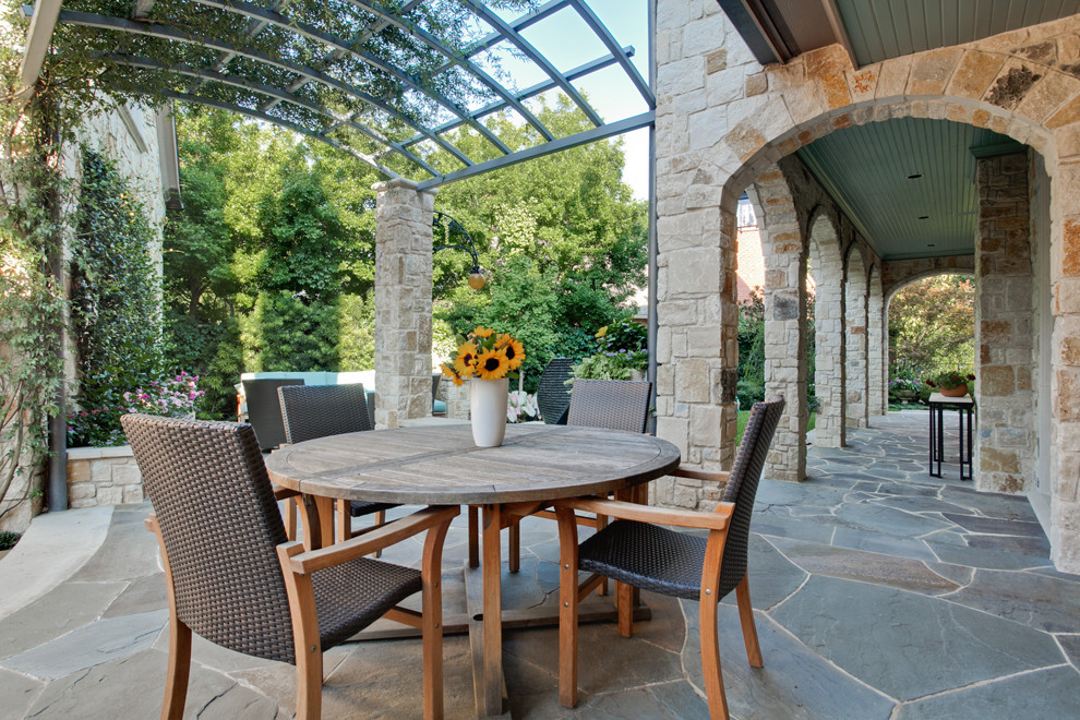 Photo of a traditional patio in Dallas with a vertical garden and a pergola.