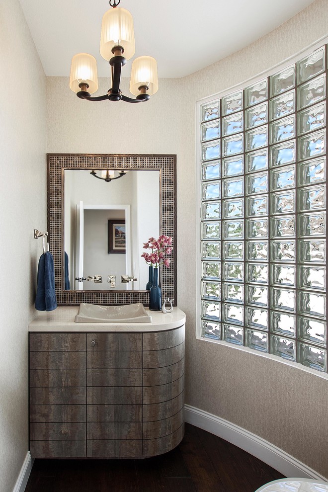 Small transitional beige tile and mosaic tile medium tone wood floor bathroom photo in Denver with a vessel sink, flat-panel cabinets, distressed cabinets, marble countertops and beige walls