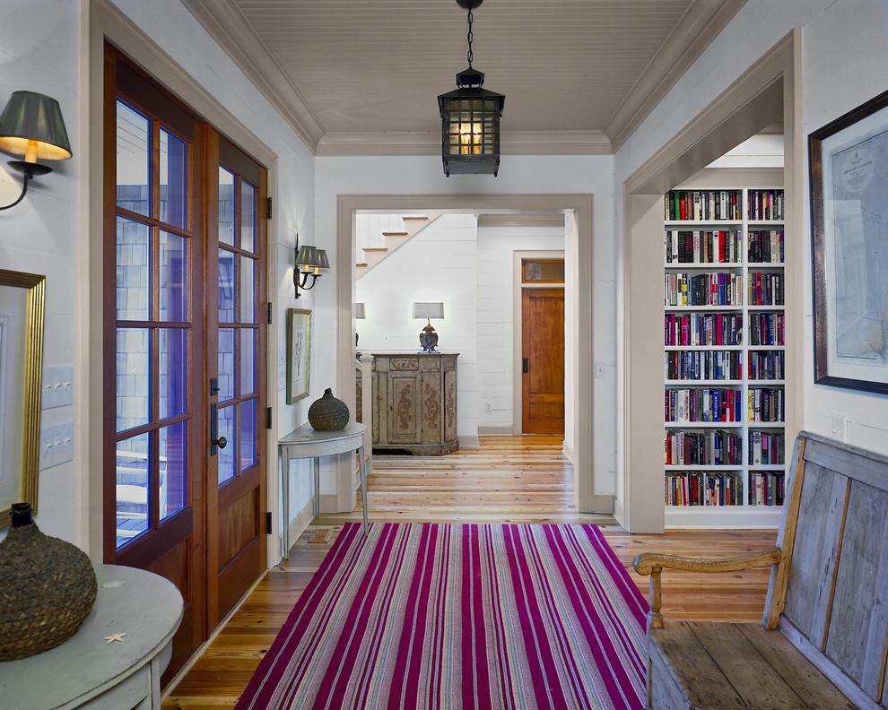 Inspiration for a beach style entryway in Charleston with white walls and a double front door.