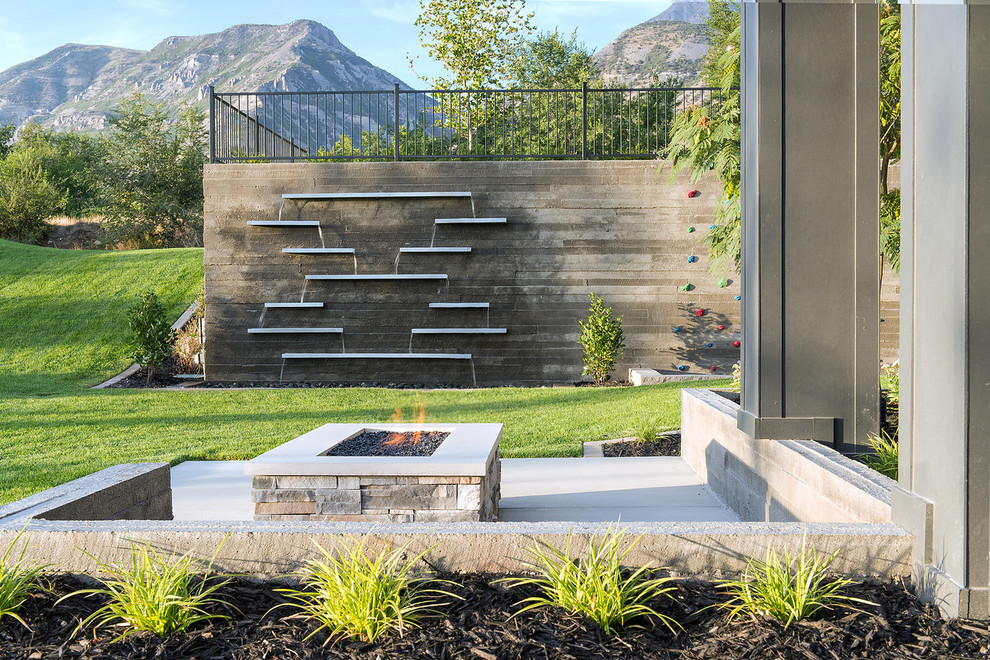 Photo of a contemporary patio in Salt Lake City with a fire feature.