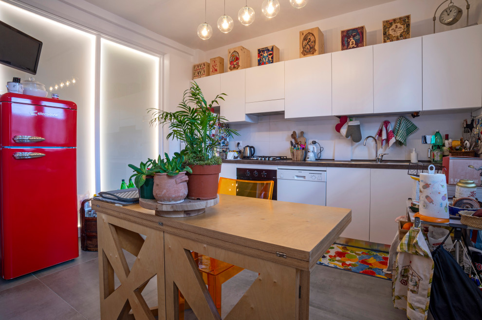 Small contemporary single-wall open plan kitchen in Florence with flat-panel cabinets, white cabinets, laminate benchtops, ceramic splashback, porcelain floors and multi-coloured benchtop.