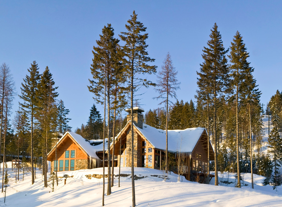 Example of a large mountain style brown one-story mixed siding exterior home design in Other with a metal roof