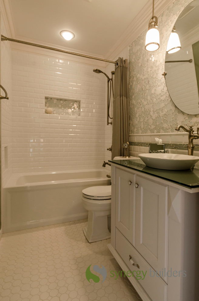 Photo of a small traditional master bathroom in Chicago with a vessel sink, recessed-panel cabinets, white cabinets, glass benchtops, an alcove tub, an alcove shower, a two-piece toilet, white tile, ceramic tile, green walls and ceramic floors.