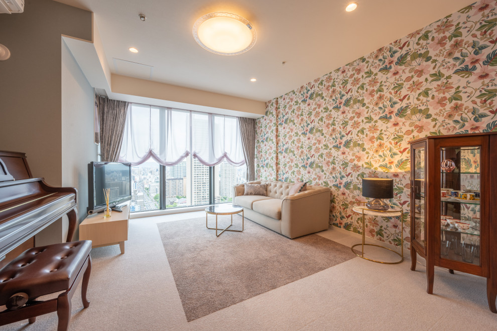 This is an example of a medium sized classic open plan living room feature wall in Osaka with pink walls, carpet, a freestanding tv, brown floors, a wallpapered ceiling and wallpapered walls.