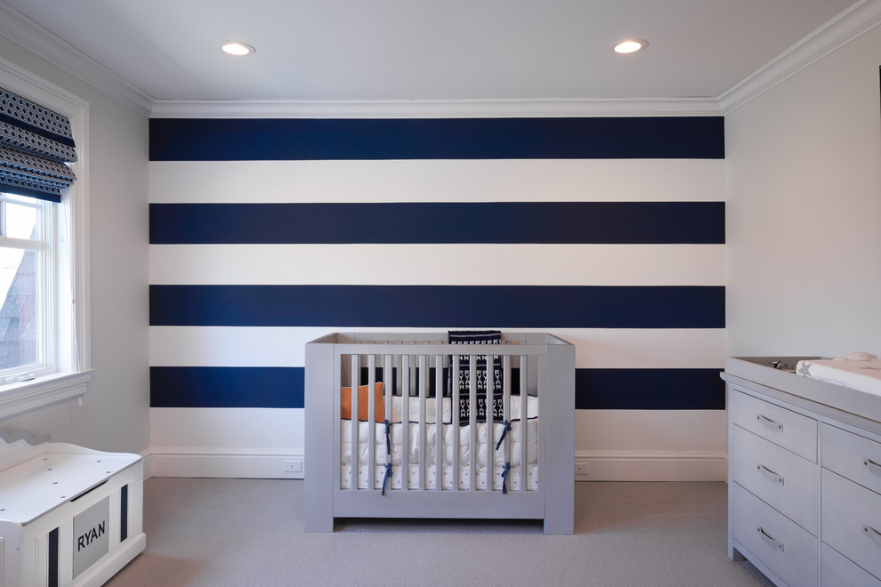 Inspiration for a mid-sized nursery for boys in New York with white walls, carpet and grey floor.