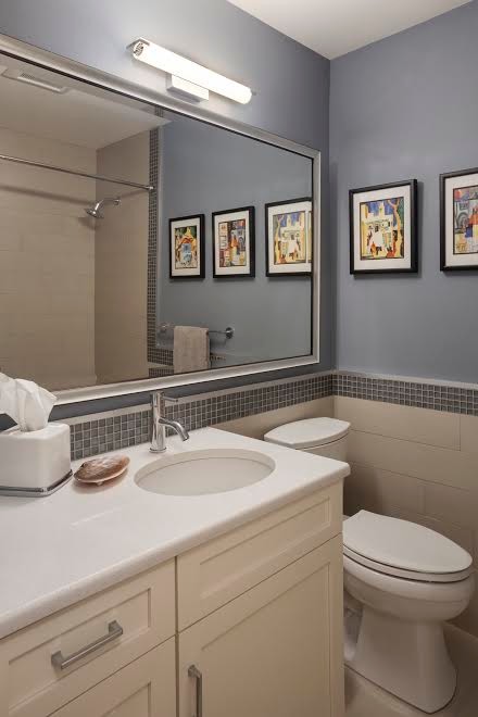 Inspiration for a transitional bathroom in Austin with shaker cabinets, beige cabinets, an alcove tub, a shower/bathtub combo, a two-piece toilet, gray tile, mosaic tile, blue walls, an undermount sink and engineered quartz benchtops.