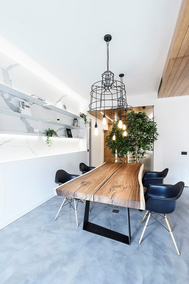 Design ideas for a mid-sized contemporary open plan dining in Rome with white walls, concrete floors, no fireplace and grey floor.