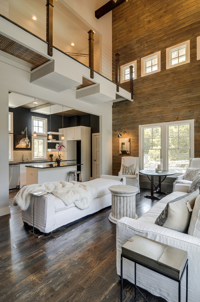 Design ideas for a contemporary open concept living room in Nashville with white walls and dark hardwood floors.