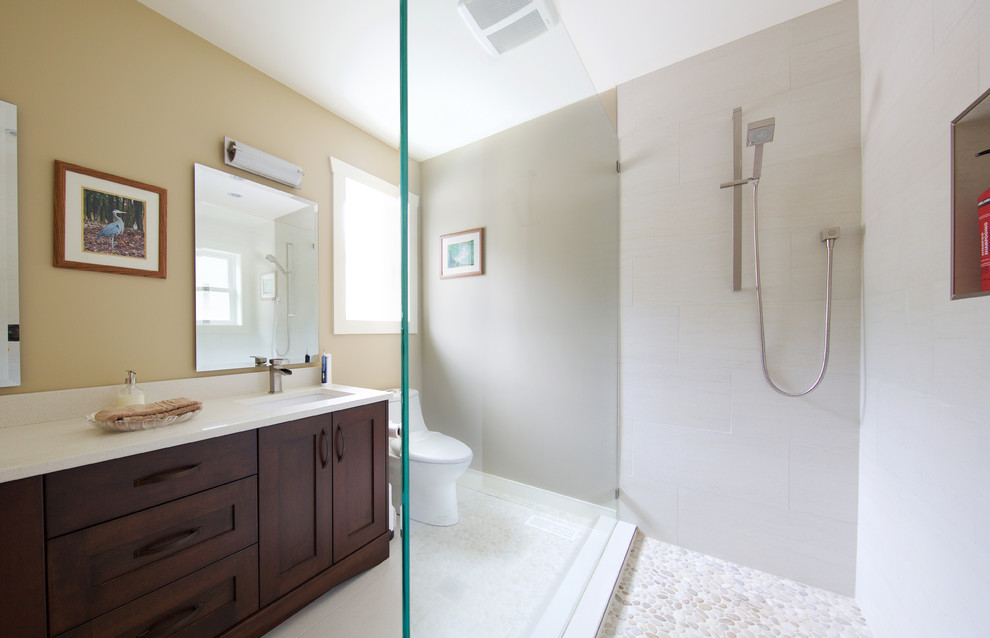 Photo of a mid-sized traditional master bathroom in Vancouver with shaker cabinets, medium wood cabinets, white tile, porcelain tile and engineered quartz benchtops.