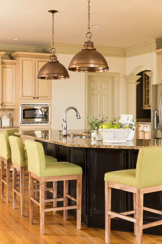 Design ideas for a large traditional kitchen in Atlanta with beige cabinets, granite benchtops, with island, an undermount sink, recessed-panel cabinets, stainless steel appliances and medium hardwood floors.