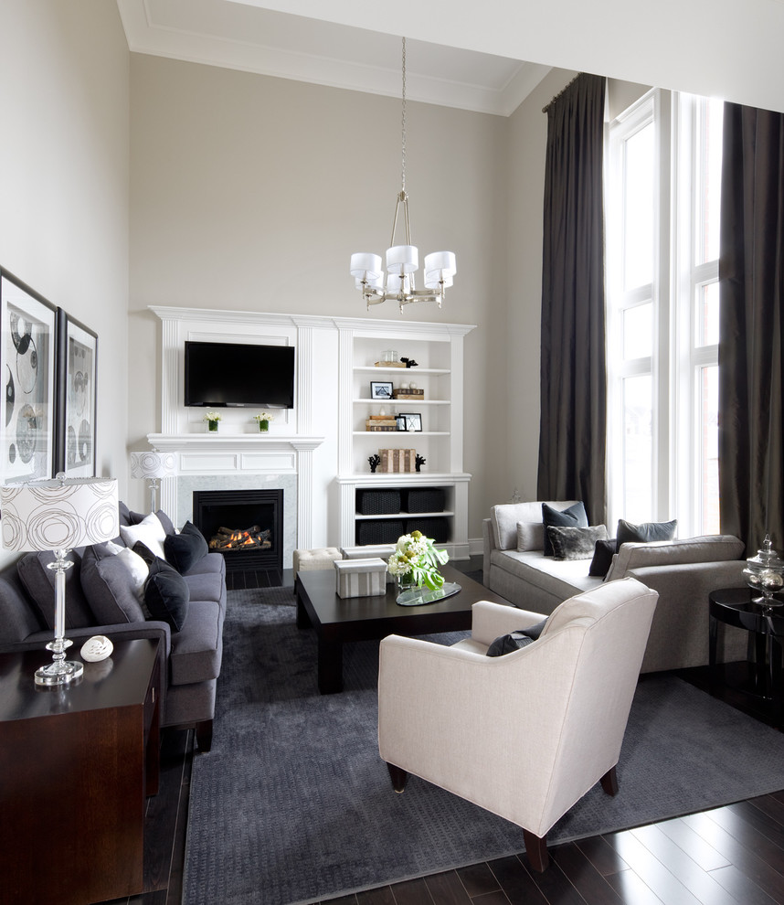 Design ideas for a transitional open concept family room in Toronto with grey walls, a standard fireplace and a built-in media wall.