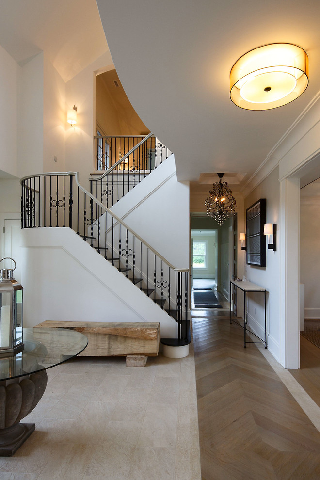Large transitional ceramic tile foyer photo in Boston with white walls and a dark wood front door