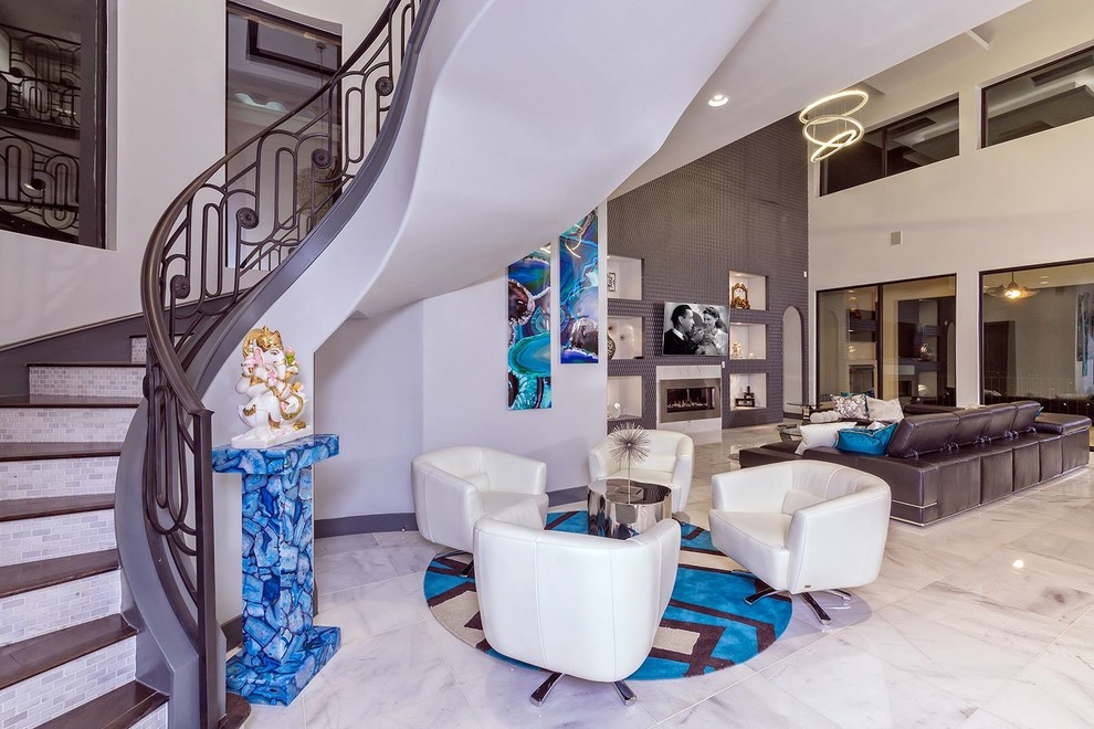 Example of a huge trendy marble floor entryway design in Austin with gray walls and a metal front door