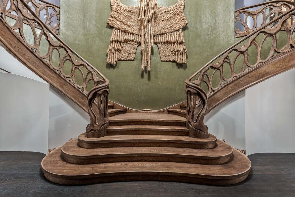 Design ideas for an expansive eclectic painted wood curved wood railing staircase in Berlin with painted wood risers.