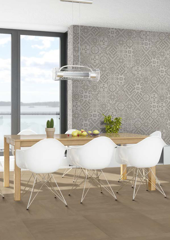 This is an example of a mid-sized eclectic separate dining room in Miami with grey walls.