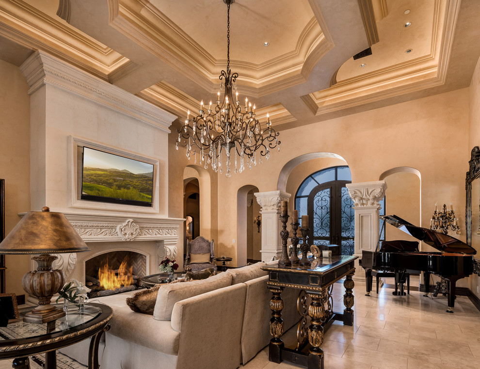 This is an example of an expansive industrial open concept family room in Phoenix with a music area, beige walls, marble floors, a standard fireplace, a stone fireplace surround, a wall-mounted tv and multi-coloured floor.