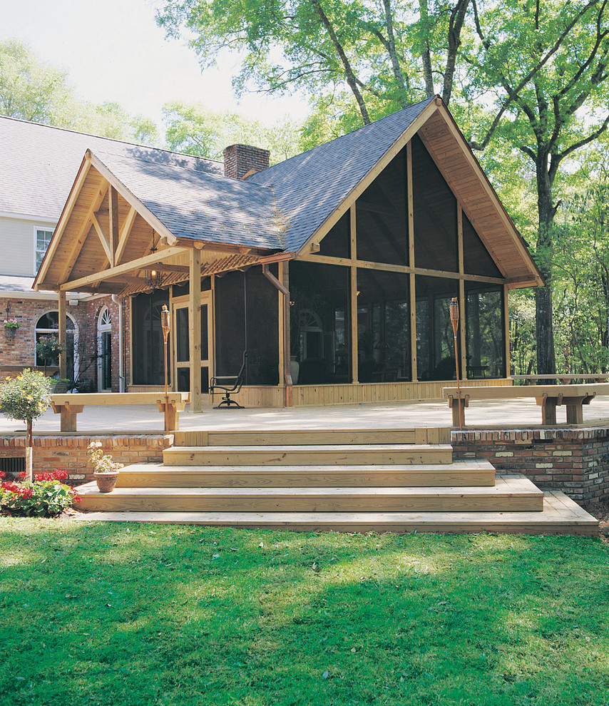 Example of a mid-sized classic backyard deck design with no cover