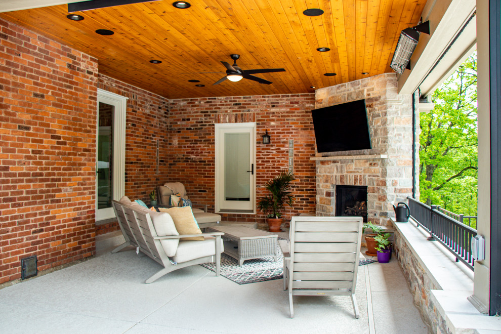 Covered Patio with an Outdoor Kitchen area and Fireplace Area Patio