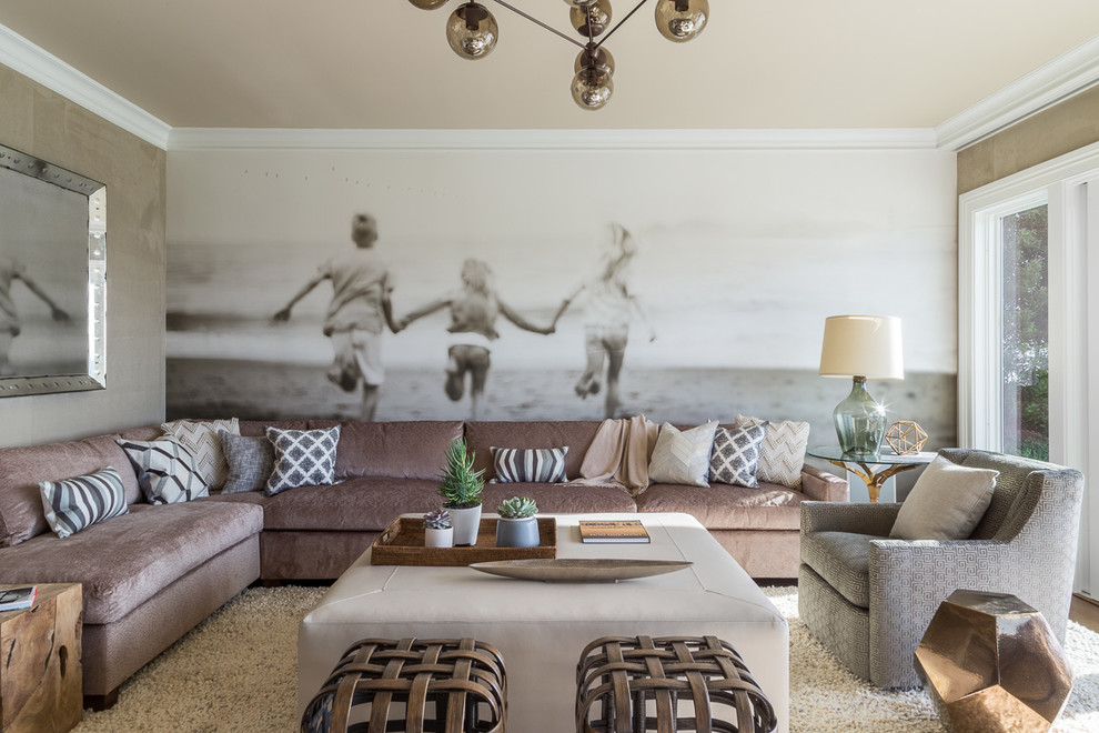 This is an example of a large transitional family room in San Francisco with beige walls and no fireplace.