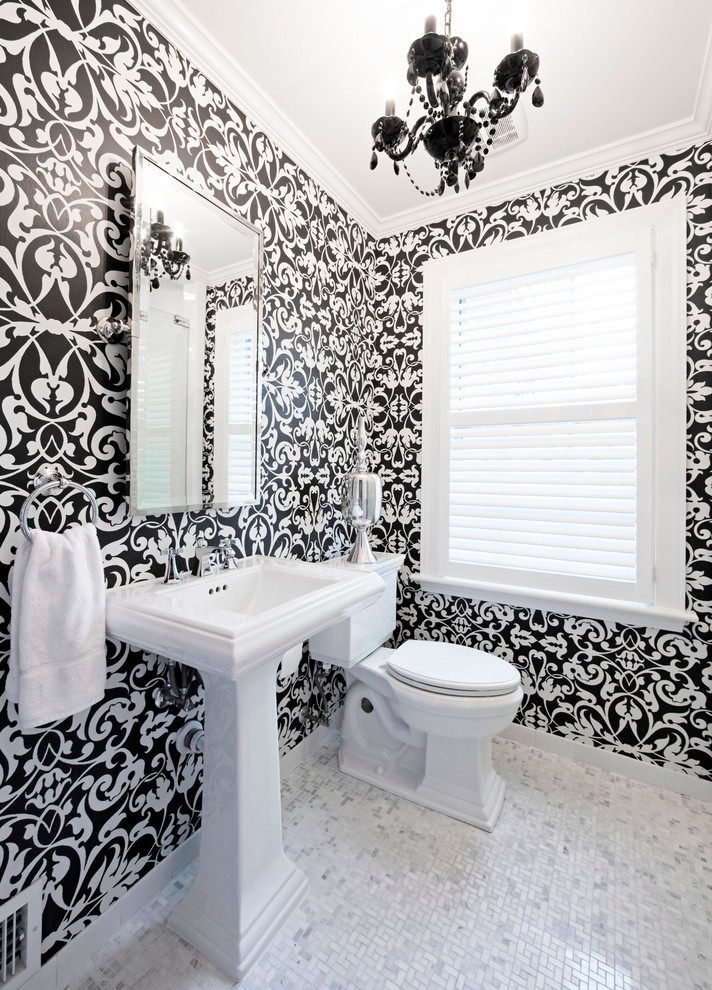 This is an example of a traditional bathroom in Chicago with a pedestal sink, white tile and mosaic tile.