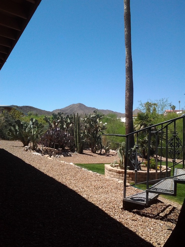Example of a mountain style exterior home design in Phoenix