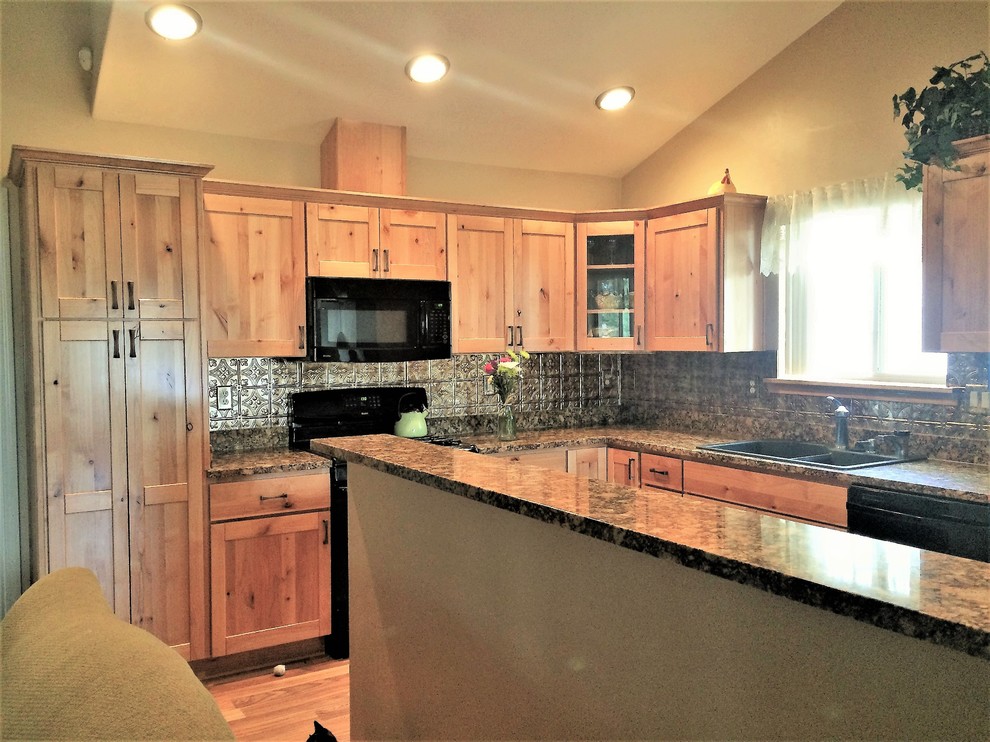 Mid-sized mountain style l-shaped eat-in kitchen photo in Phoenix with shaker cabinets, light wood cabinets, granite countertops, metallic backsplash, metal backsplash and an island