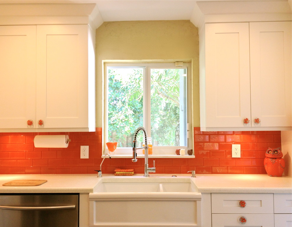 Traditional kitchen in San Francisco with orange splashback and glass tile splashback.
