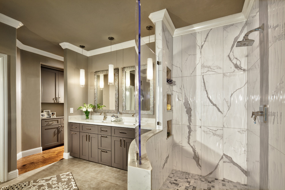 Photo of a large transitional master bathroom in Sacramento with shaker cabinets, grey cabinets, a freestanding tub, a corner shower, a two-piece toilet, white tile, porcelain tile, grey walls, porcelain floors, an undermount sink, engineered quartz benchtops, grey floor, an open shower and white benchtops.