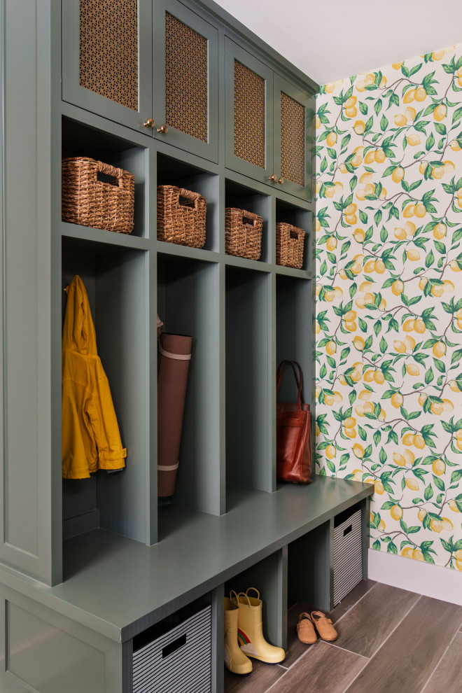 Design ideas for a transitional entryway in Austin with multi-coloured walls, brown floor and wallpaper.