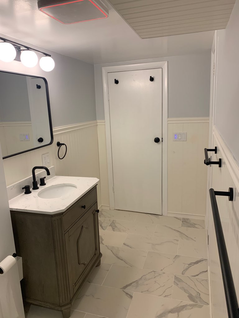 Doorless shower - mid-sized transitional 3/4 white tile and porcelain tile porcelain tile, white floor and single-sink doorless shower idea in Boston with furniture-like cabinets, brown cabinets, a tw