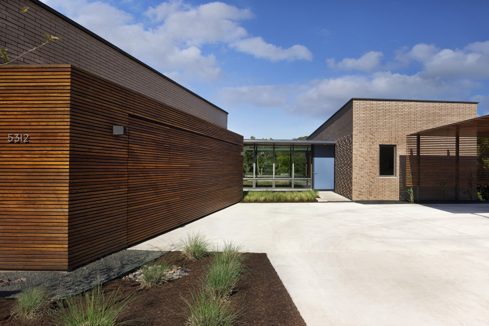 This is an example of a modern exterior in Austin with wood siding.
