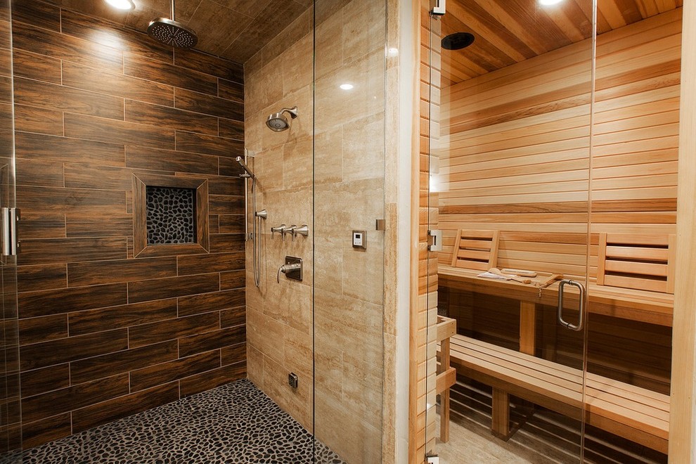 Design ideas for a large transitional bathroom in Salt Lake City with raised-panel cabinets, dark wood cabinets, an alcove shower, a one-piece toilet, brown tile, porcelain tile, white walls, light hardwood floors, an undermount sink, granite benchtops, brown floor, a hinged shower door and with a sauna.