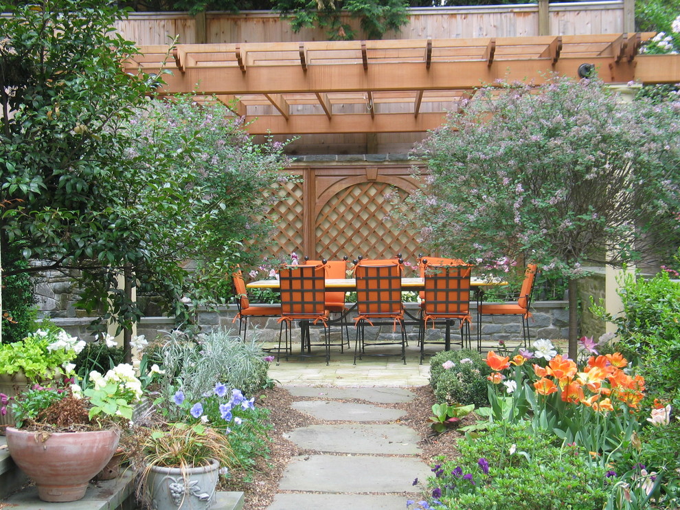 Mediterranean patio in DC Metro with a pergola and a water feature.