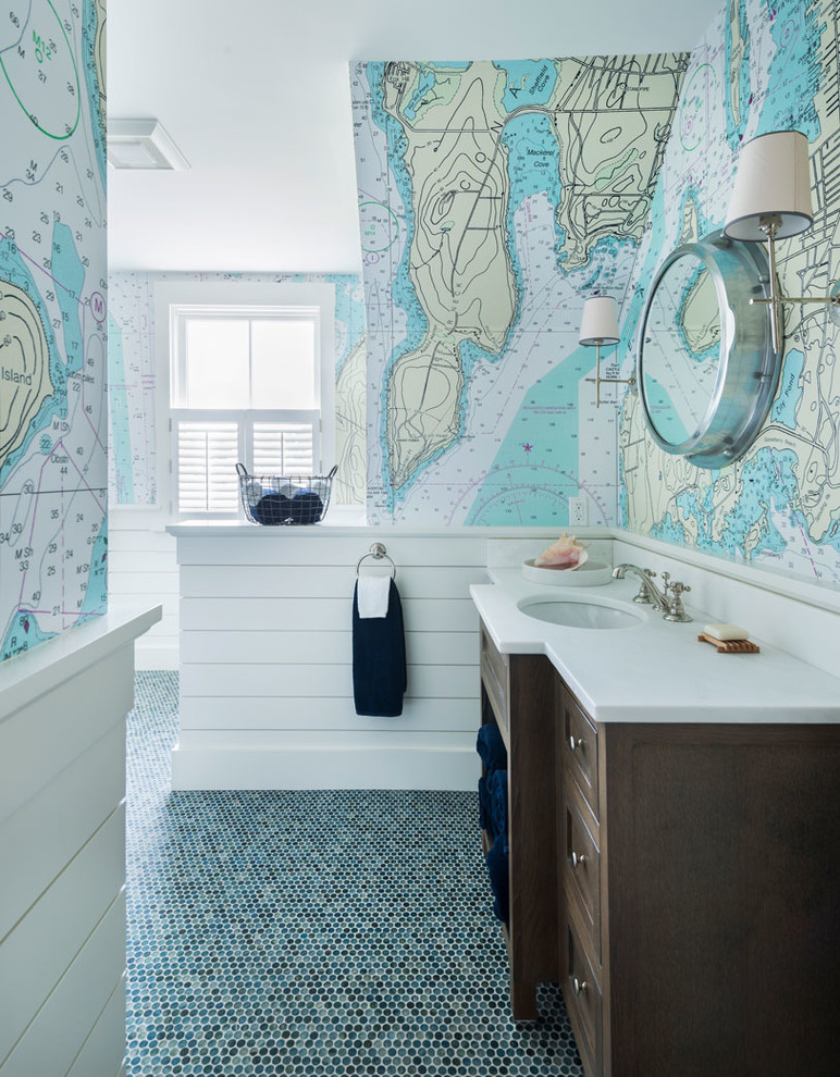 This is an example of a beach style bathroom in Providence with dark wood cabinets, multi-coloured walls, mosaic tile floors, an undermount sink and green floor.