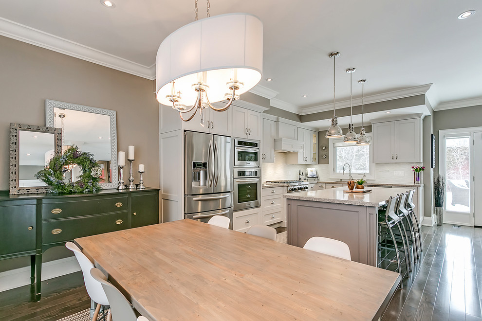 Small transitional dark wood floor and brown floor great room photo in Toronto with beige walls and no fireplace